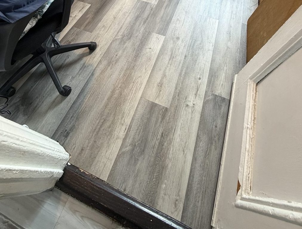Gray floor visible at bedroom doorway